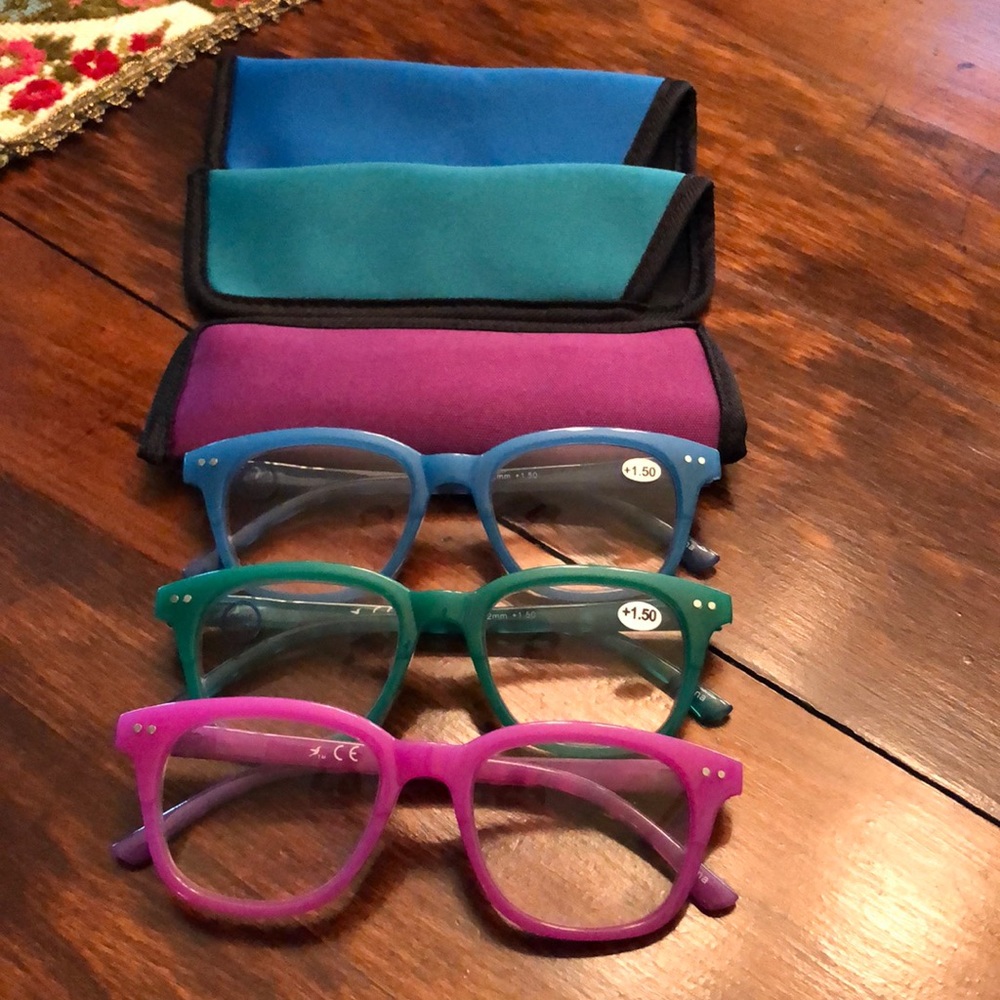 Set of magnifying readers, 1.5 strength. Blue, green, pink with matching cases.